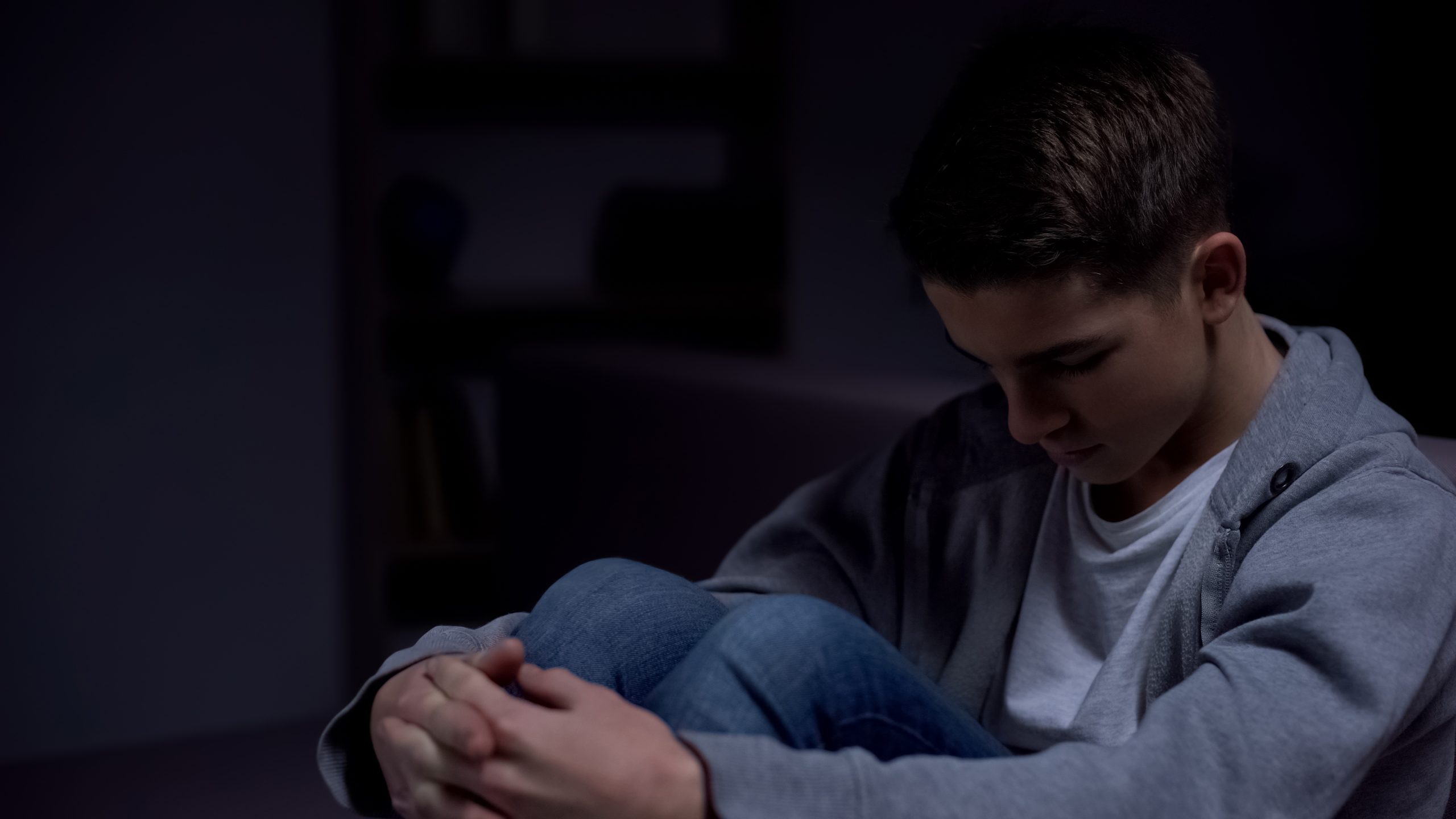 Teenage boy in domestic violence household
